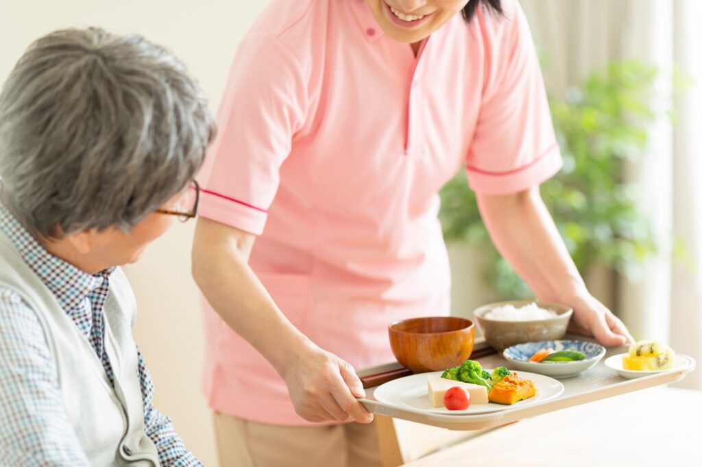 A caregiver preparing meals