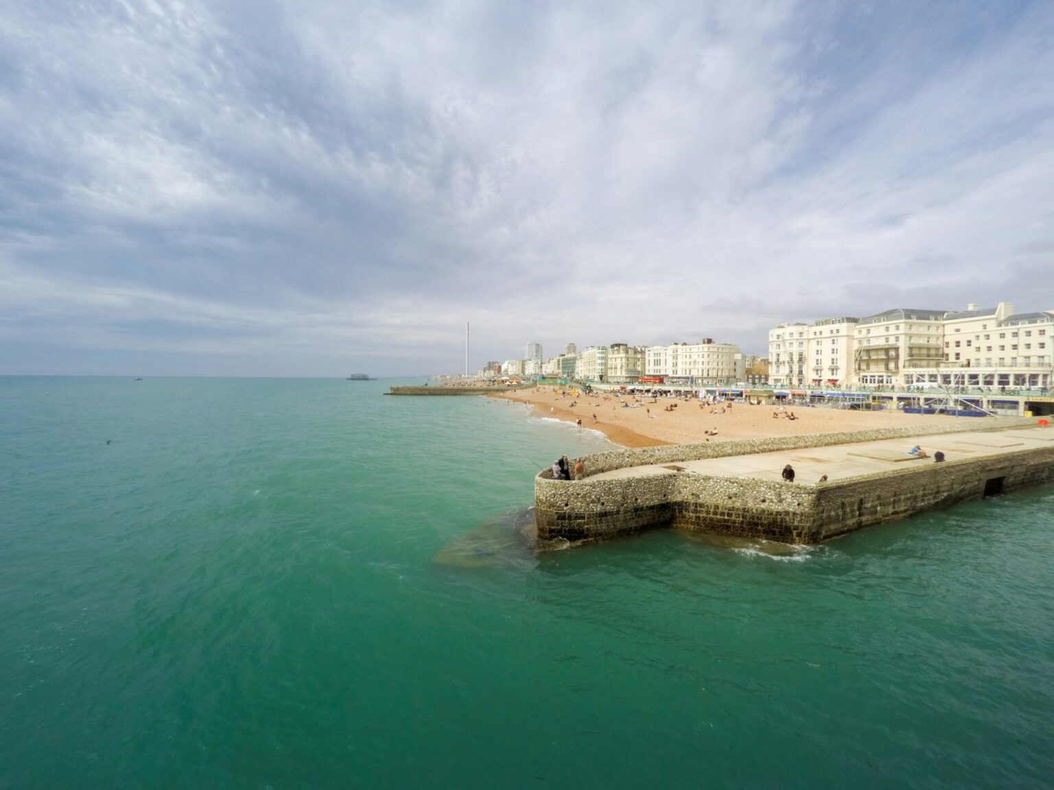 Brighton beach with a pier and buildings on the seafront