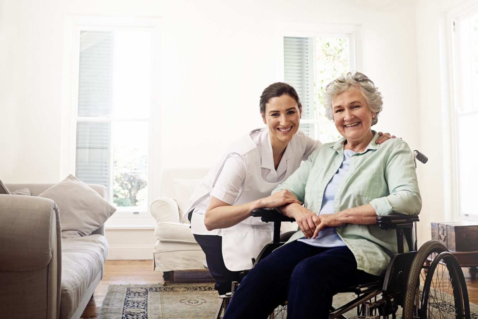 Nurse, portrait and woman disability in wheelchair, medical wellness or homecare support. Caregiver helping disabled patient, senior healthcare and service of elderly rehabilitation with mockup