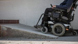 Ramp for disabled persons on wheelchair at building entrance.